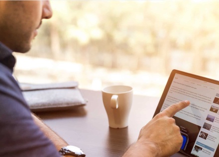 man pointing at tablet