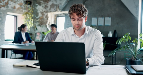 Businessman working on a laptop in an office in Colombia