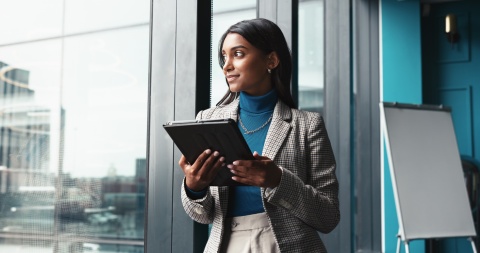 HR manager reading about how to hire in Estonia