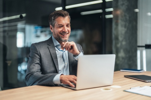 Global HR manager researching employee costs by country