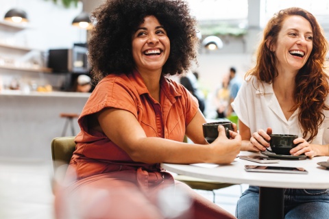 HR team laughing while learning about employee benefits trends