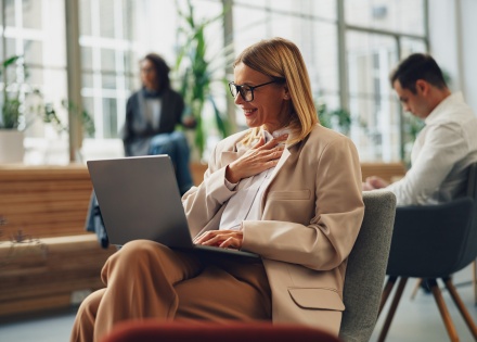 Global HR manager smile while researching work visas Sweden