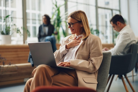 Global HR manager smile while researching work visas Sweden