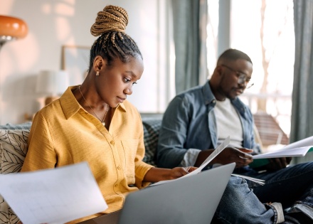 Two colleagues read about how to get work authorization in brazil