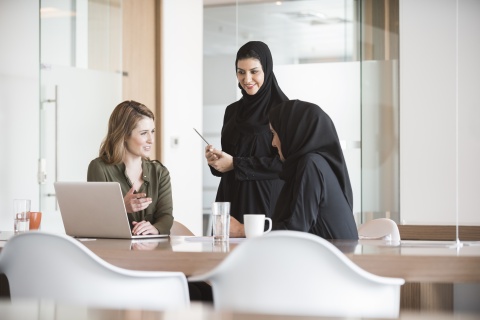 Colleagues discuss global trends in human resource management