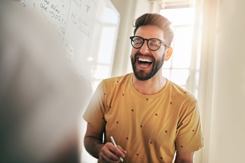 Global HR team member laughing at work