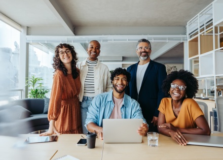 Global HR team poses for a photo at their office