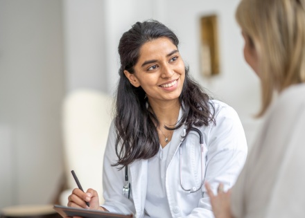 Woman consults with her private health insurance provider at a clinic
