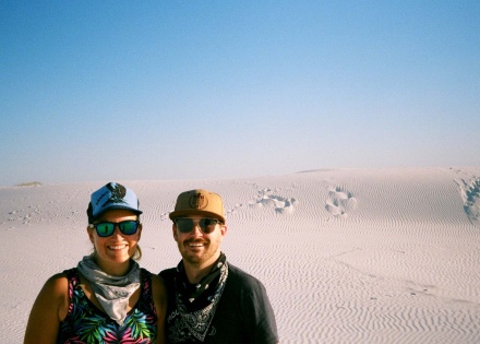 A couple smiling in the desert