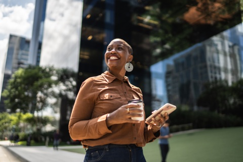 HR manager smiling while reading about work visas in Bahrain