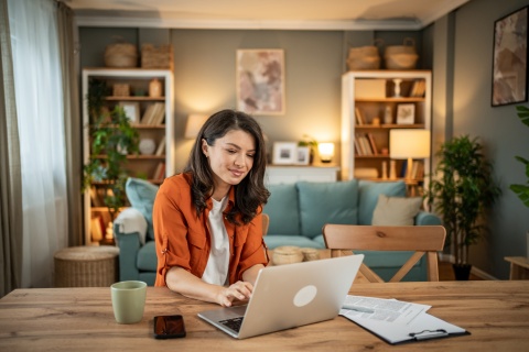 HR manager reviewing temporary remote work request forms