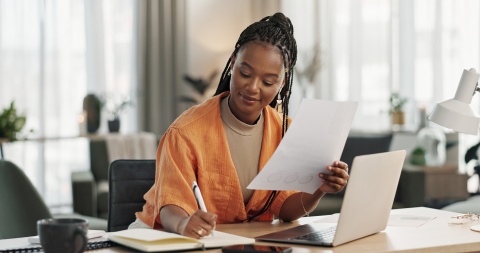 CHRO going over paperwork to hire in Cameroon compliantly.